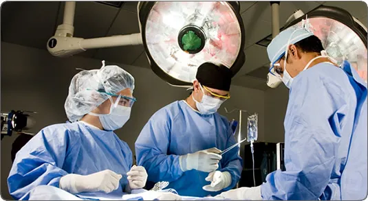 Dr. John R. Pasqual performing surgery